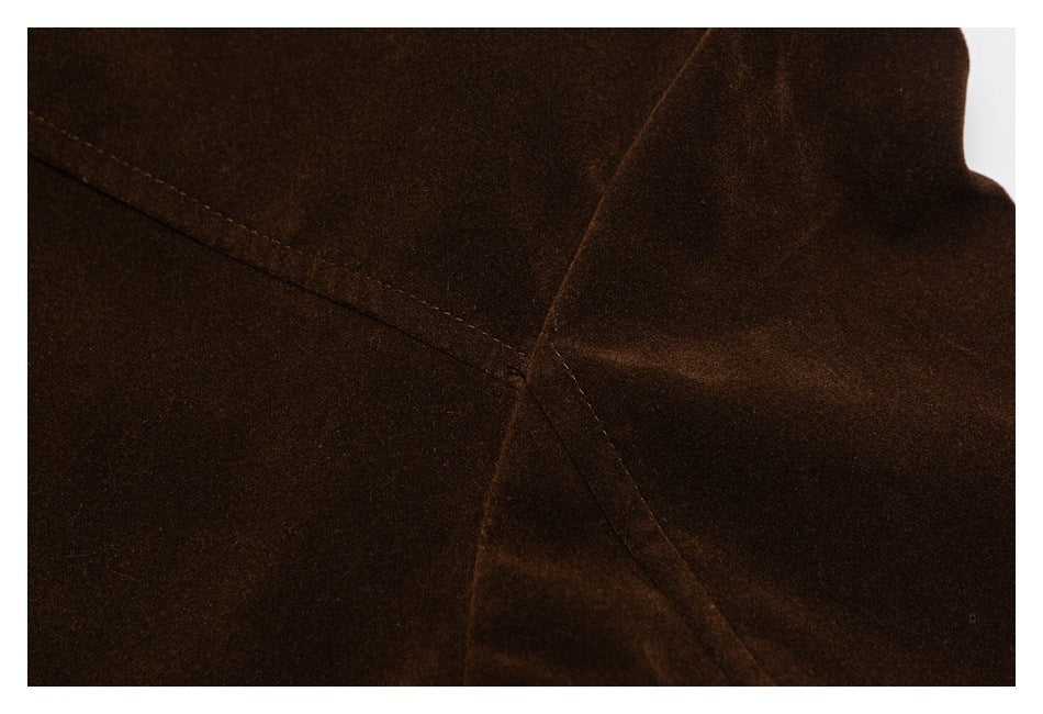 Close-up of stitching and a seam on the dark brown jacket.