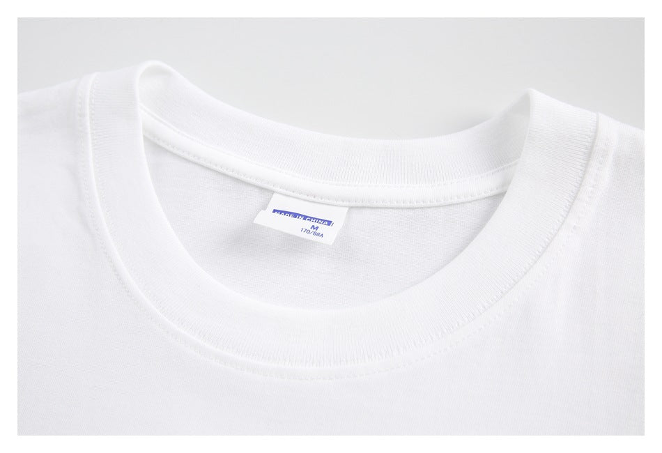 Close-up of a white T-shirt crew neck with a label reading “MADE IN CHINA,” size M, and 170/88A.