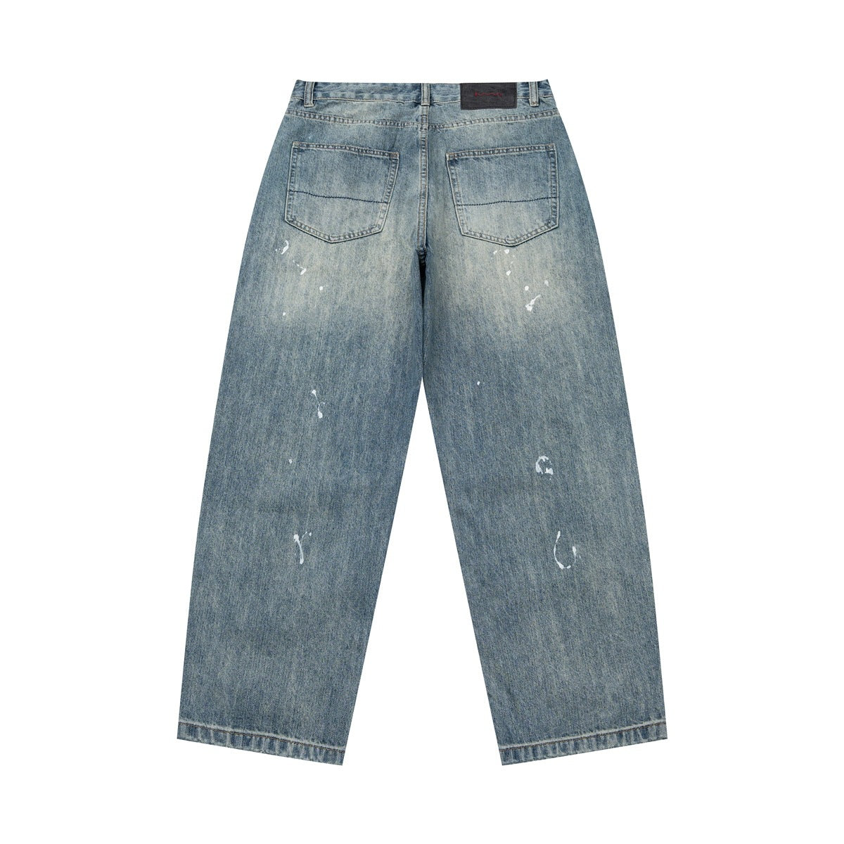 Full back view of faded blue jeans with two pockets, scattered white marks, and wide straight legs.