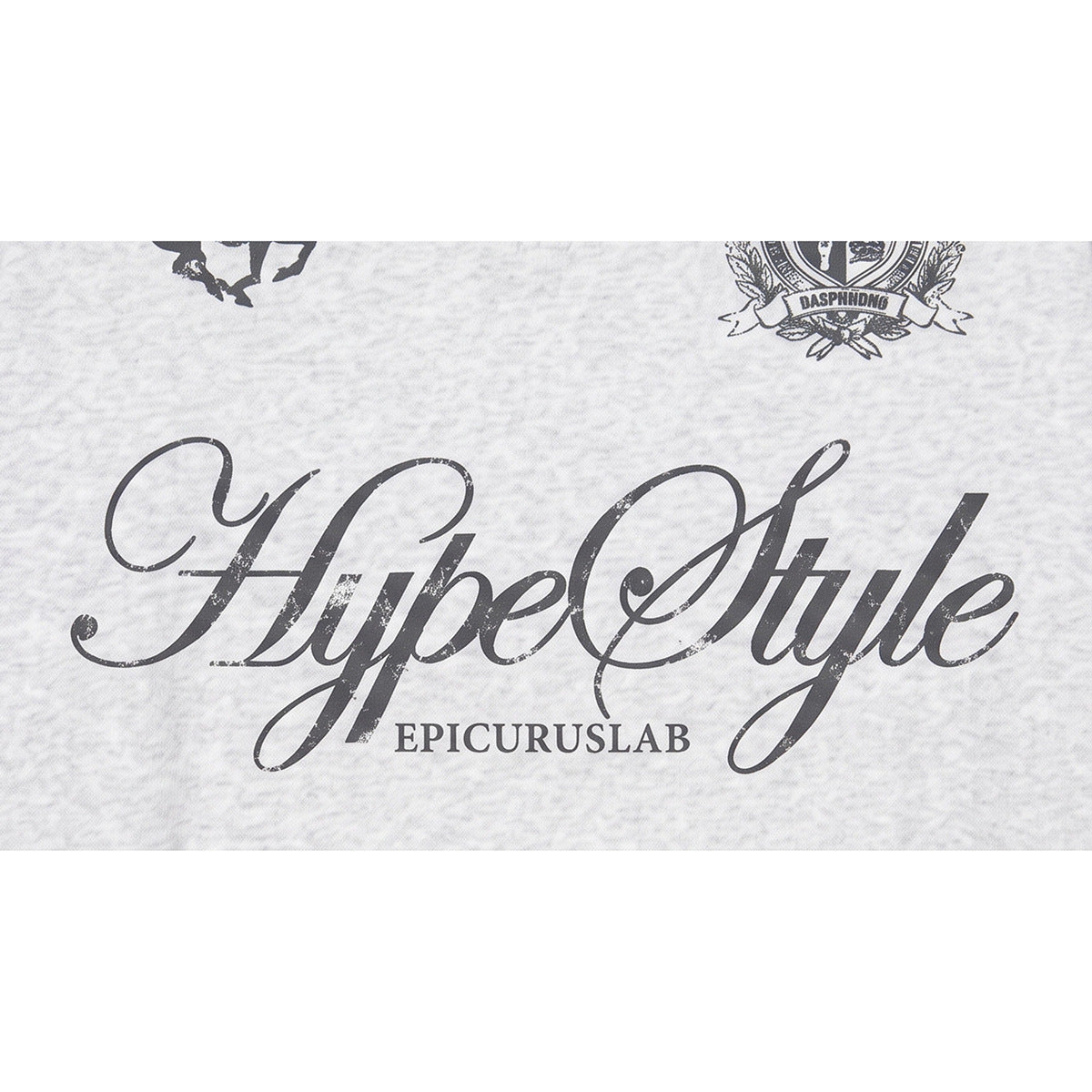 Close-up of large dark script and smaller lettering printed on light gray marled sweatshirt fabric.