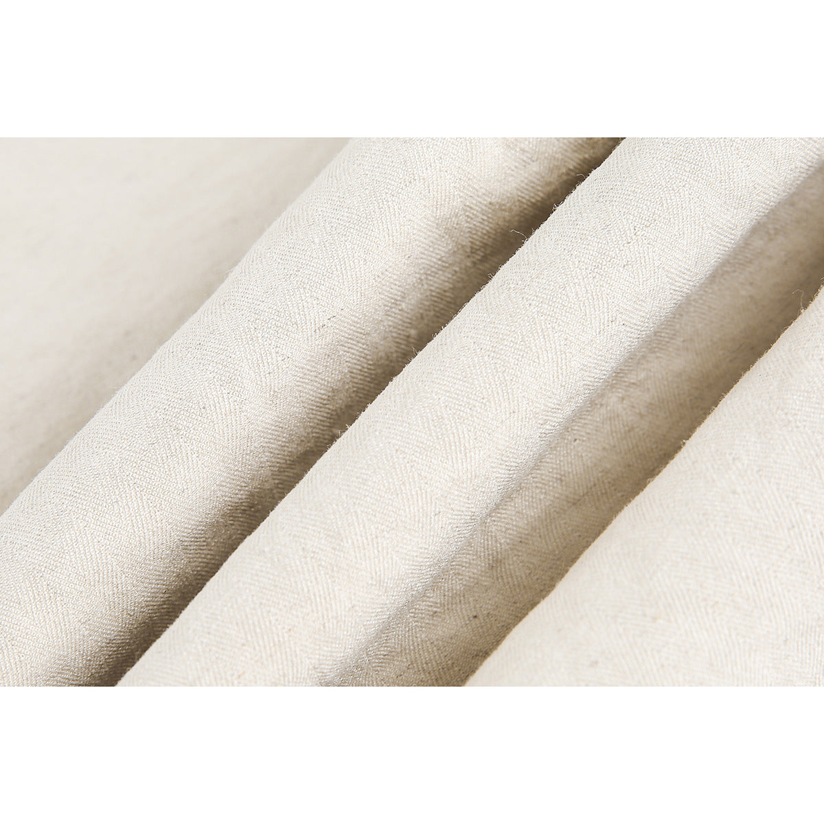 Macro view of ivory fabric folds and woven texture.