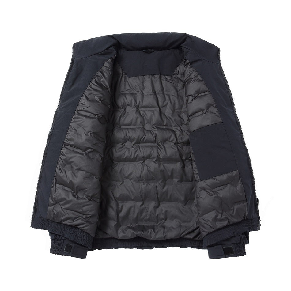 Dark jacket opened flat to show its quilted lining, inner pocket, and elastic hem and cuffs.