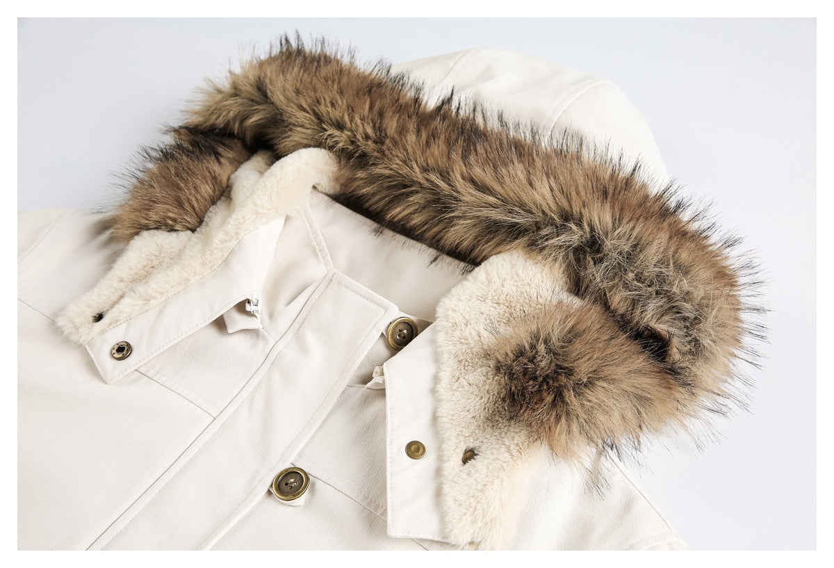 Close-up of the ivory jacket's hood, brown faux-fur trim, plush lining and front buttons.