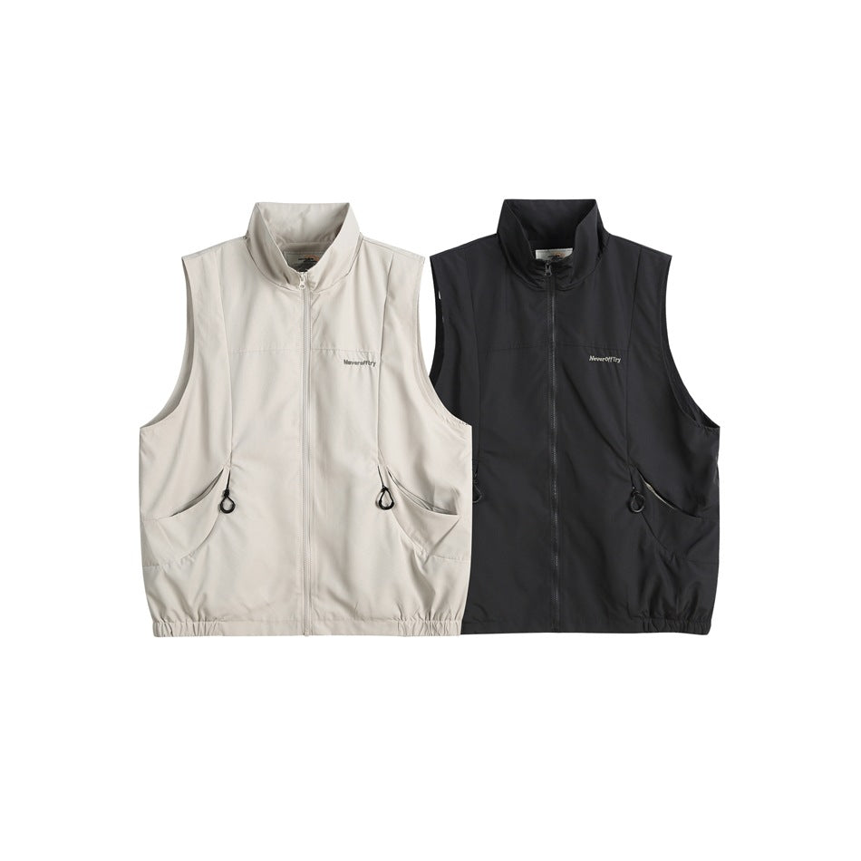 Two sleeveless zip vests shown side by side in light gray and black, each with a high collar and front pockets.