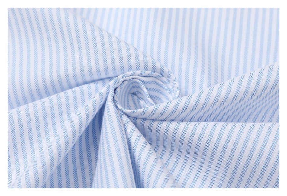 Close-up of light blue and white striped fabric gathered into a loose twist.
