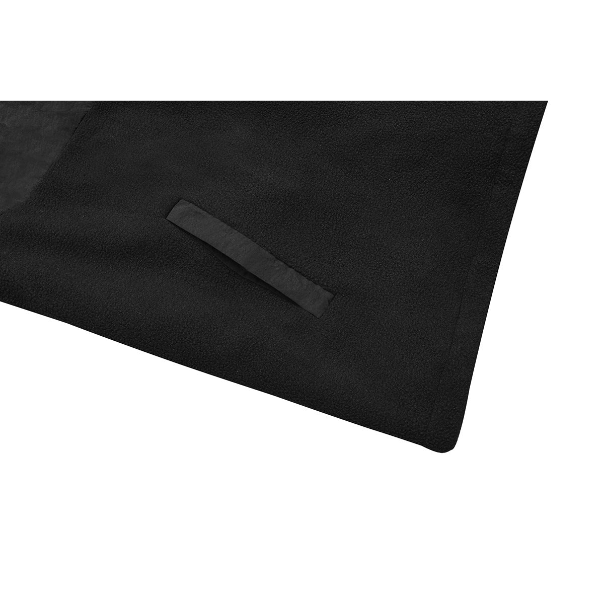 Close-up of black textured fabric with a narrow angled welt pocket opening.
