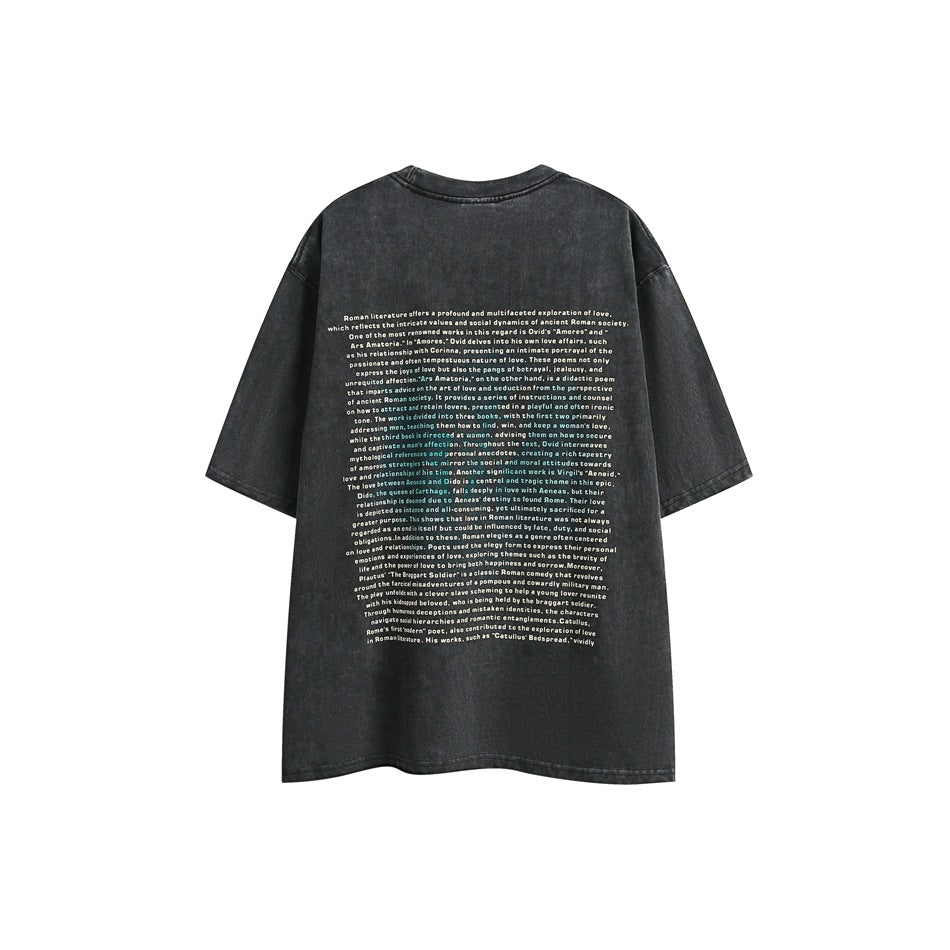 Back view of a charcoal washed oversized T-shirt with a large block of small white text printed on the back.