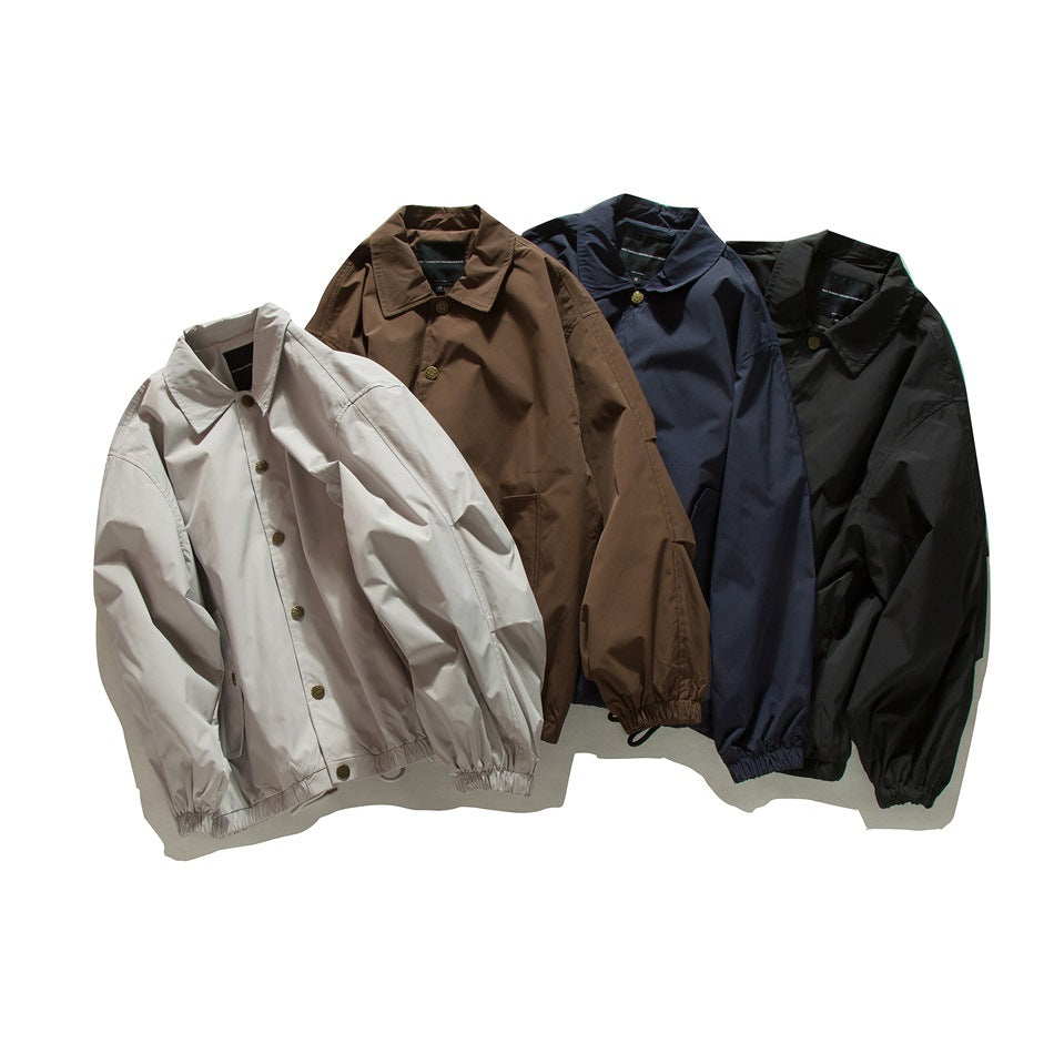 Four collared jackets with button fronts and gathered cuffs and hems, shown in light beige, brown, navy, and black.