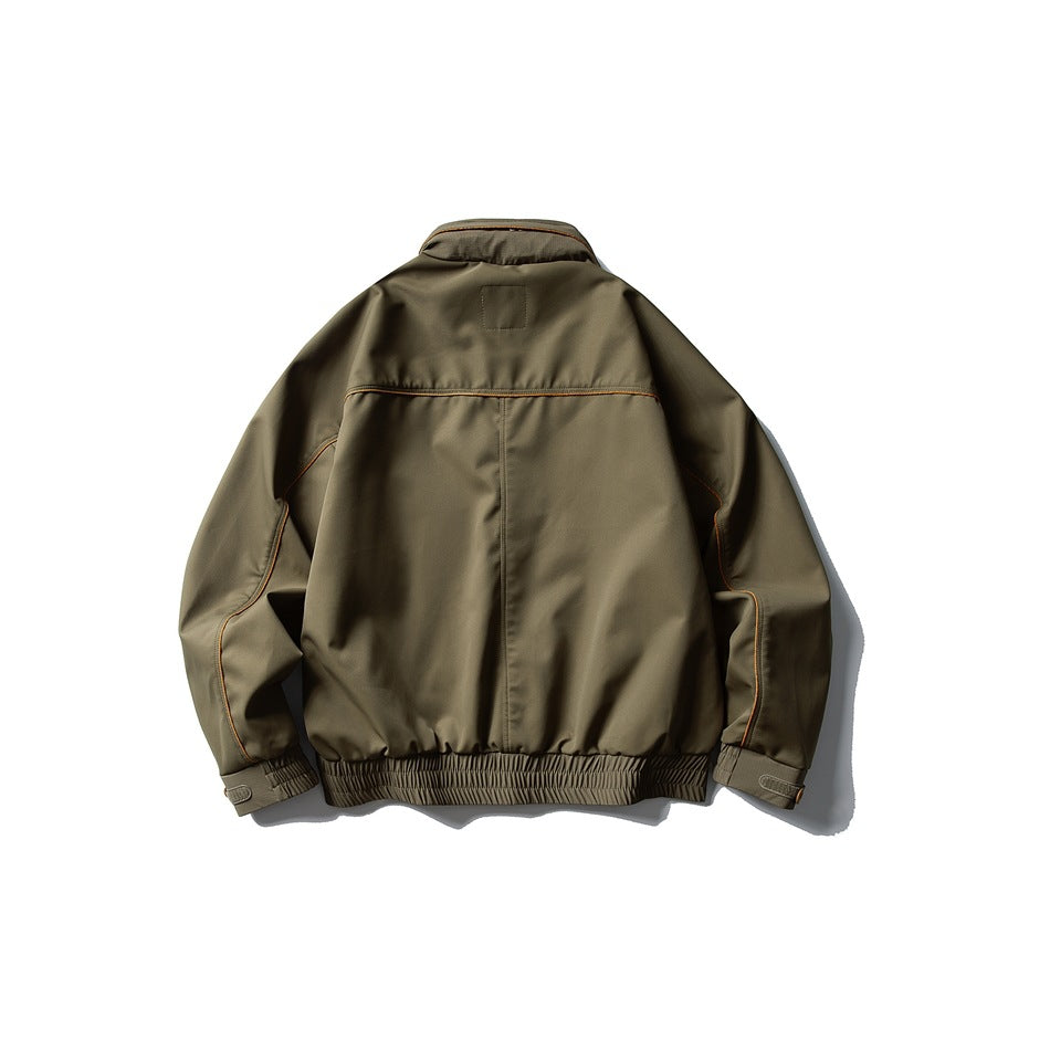 Back view of an olive-brown jacket with orange piping, a center seam and gathered elastic hem.