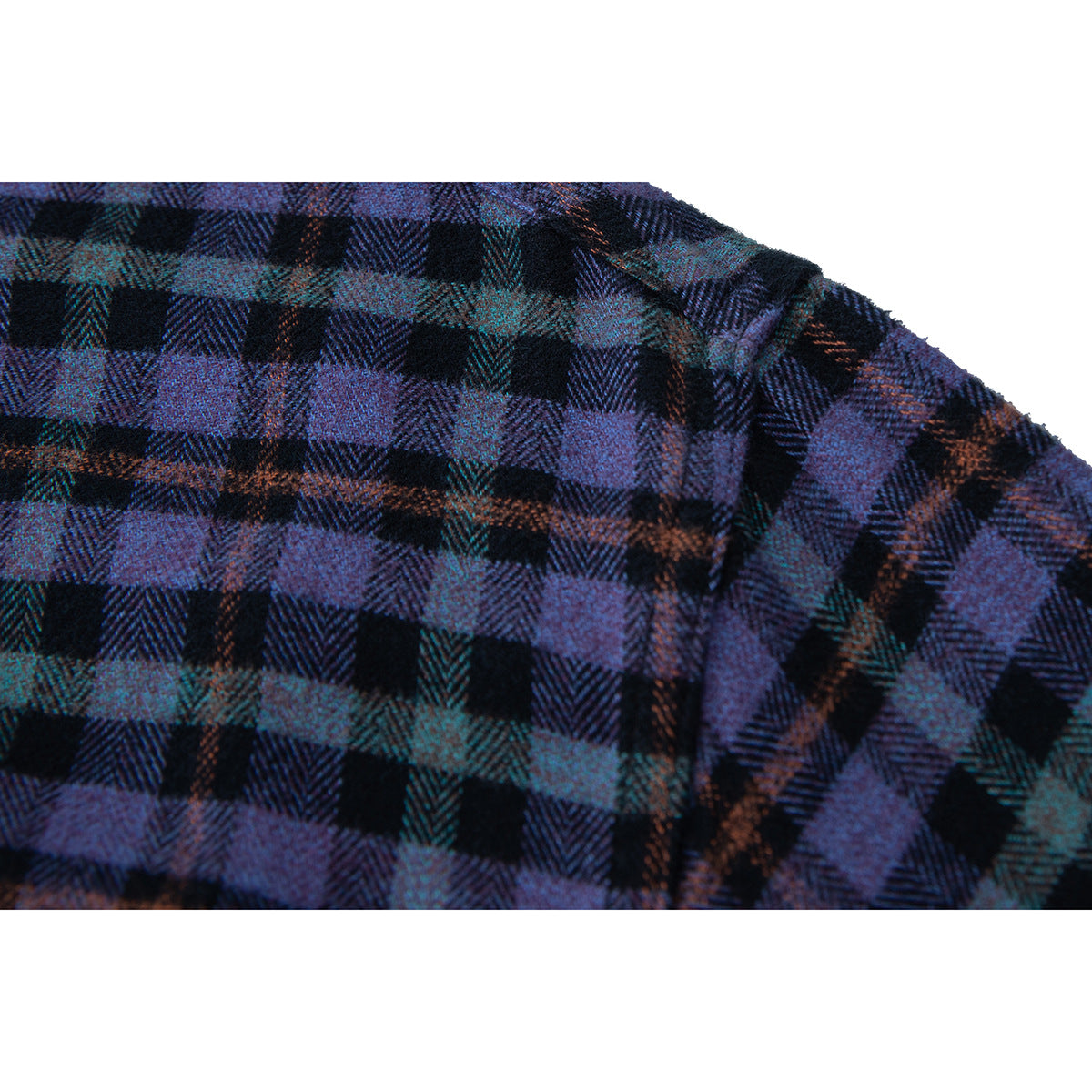 Close-up of the shirt's plaid fabric and shoulder seam in purple, teal, and black.