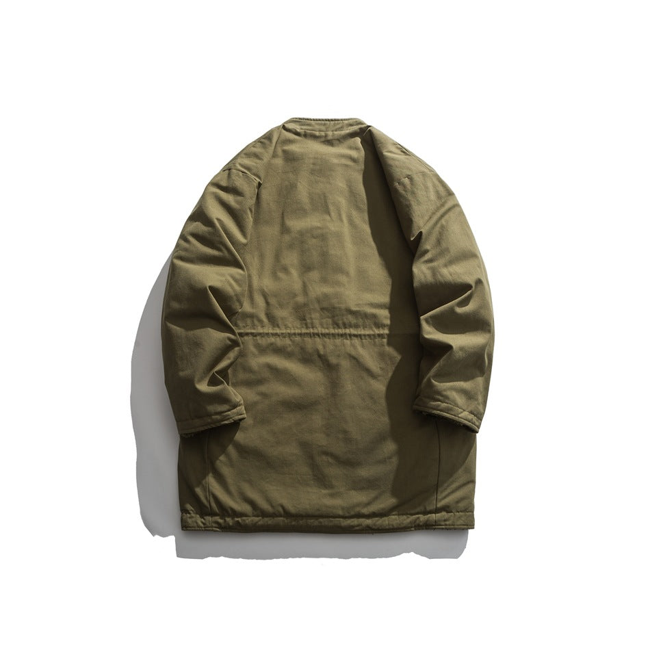 Back view of olive green mid-length jacket flat lay with waist seam and plain back panel