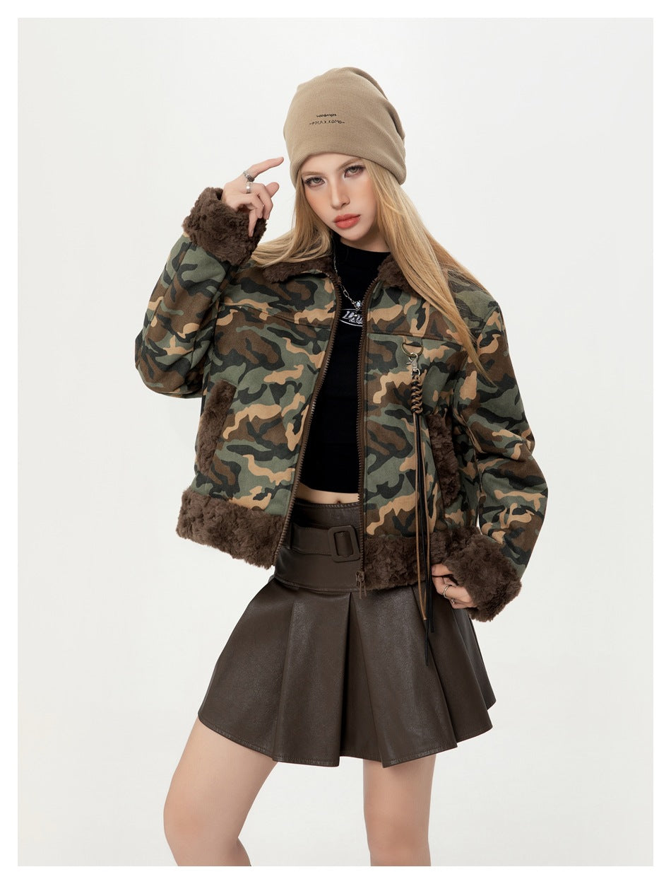 Closer view of a model wearing a camouflage jacket with dark brown plush trim, zipper and hanging cord details.