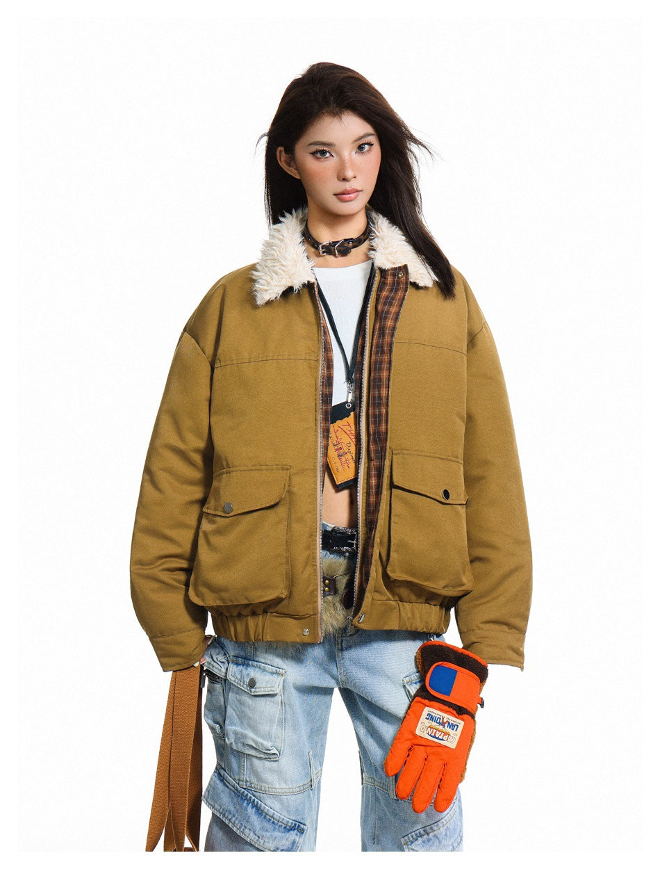 Model wearing an open tan jacket with cream fleece-like collar and plaid inner facing over a white top and light cargo jeans
