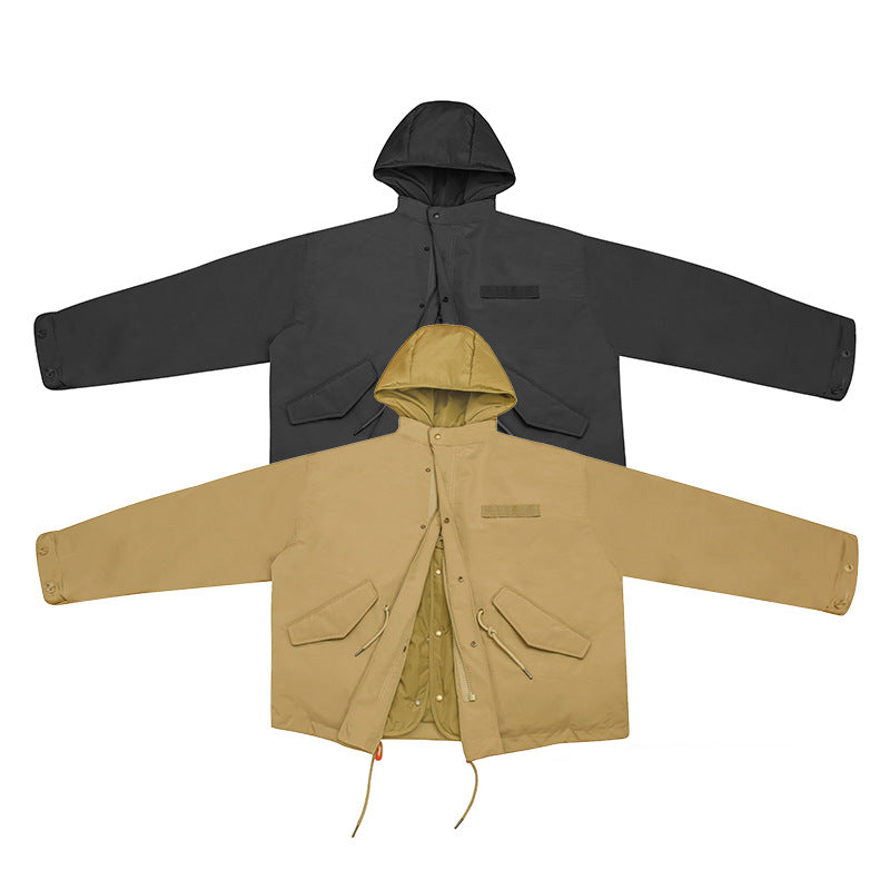Two hooded jackets displayed flat from the front: one charcoal and one tan, both with long sleeves and drawcords.