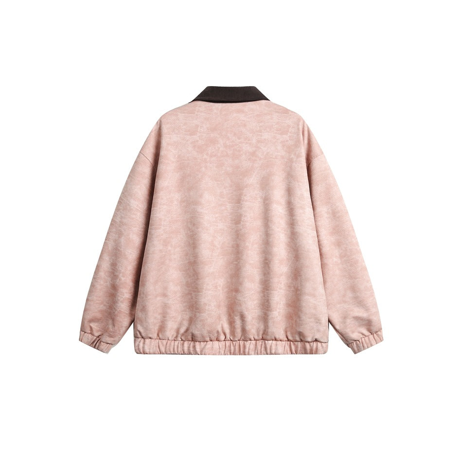 Back view of a dusty pink mottled jacket with a dark brown ribbed collar and gathered cuffs and hem.