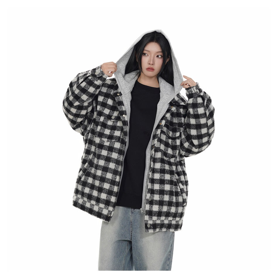 Model wearing the black and white check jacket open over a black top, with the gray hood up and zip visible