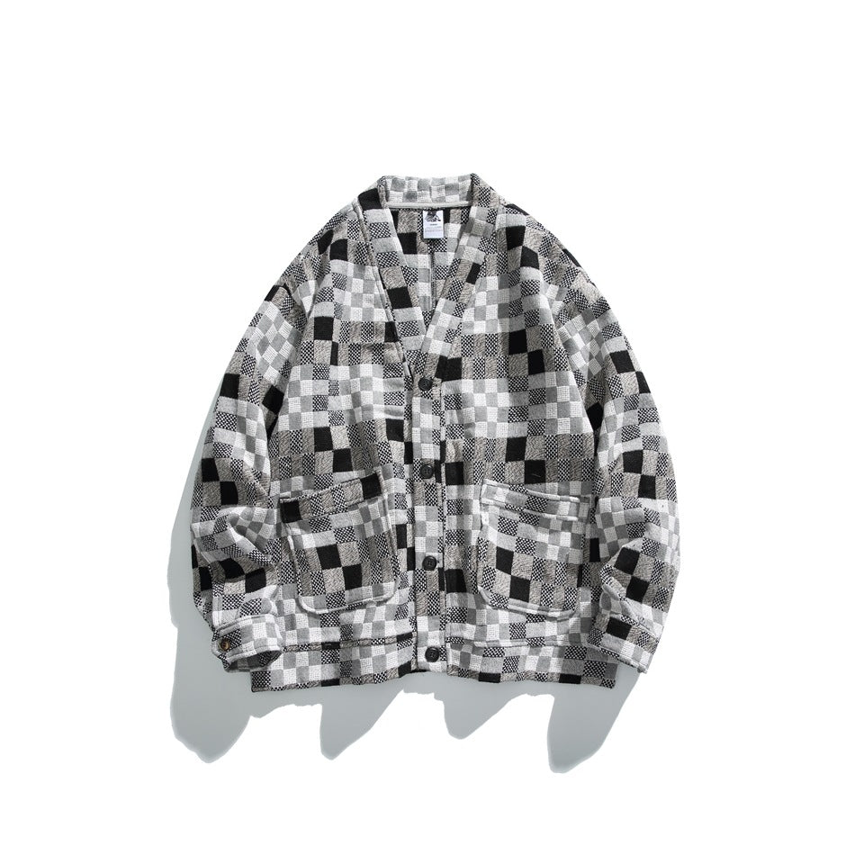 Gray, black and white checkerboard woven button-front V-neck jacket with two flap pockets, flat lay