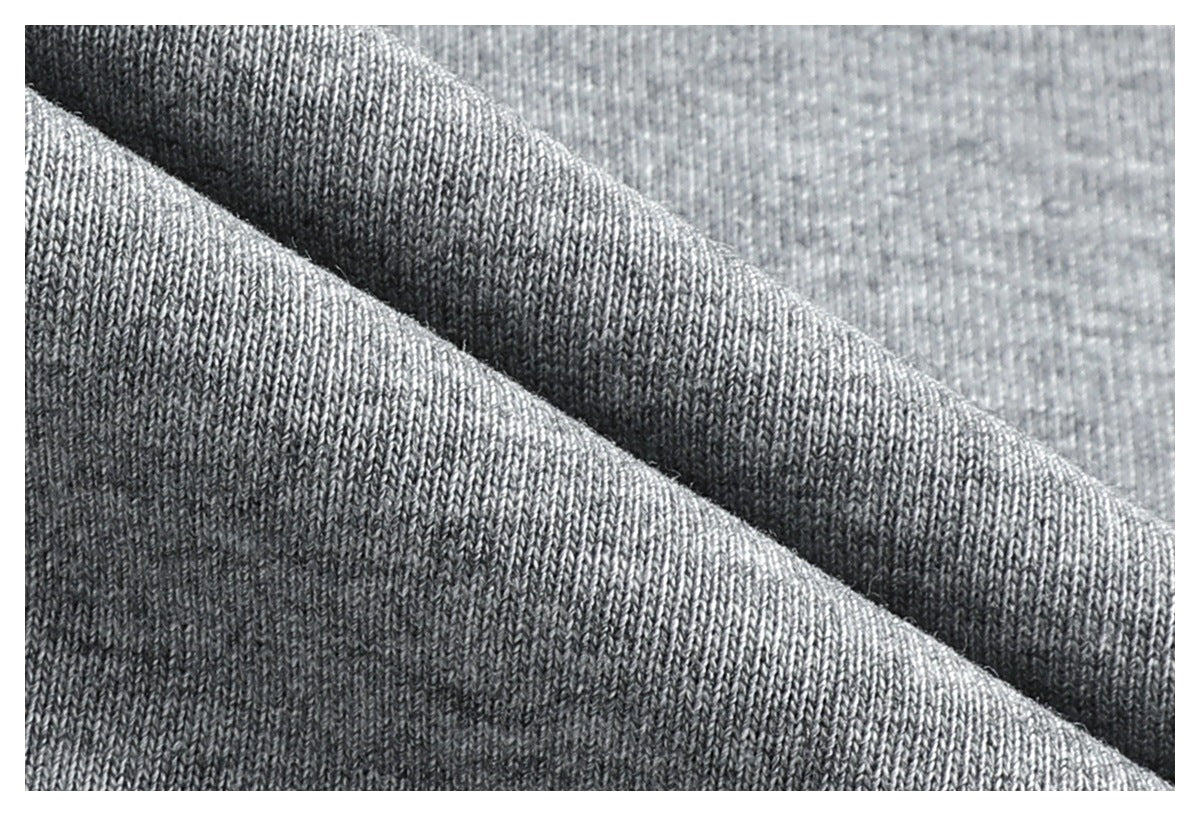 Close-up of the heather gray garment's knit fabric texture and folded edge.