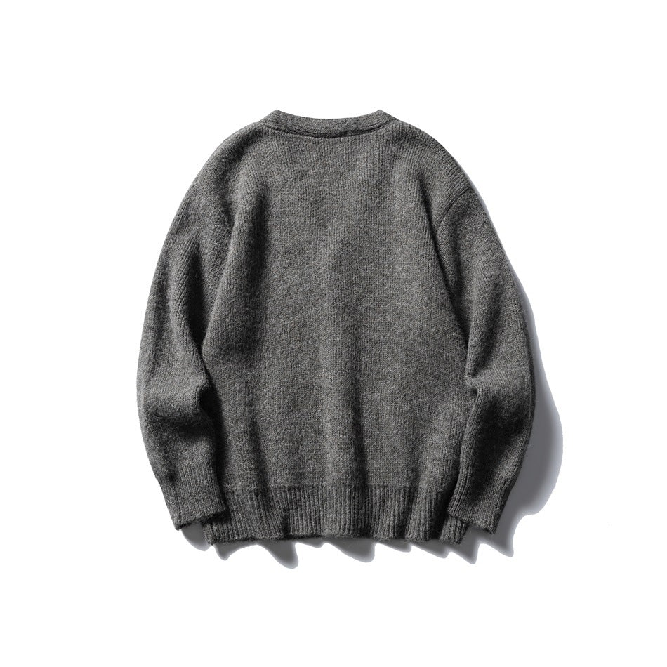 Back view of a plain gray knit cardigan with long sleeves and ribbed cuffs and hem.