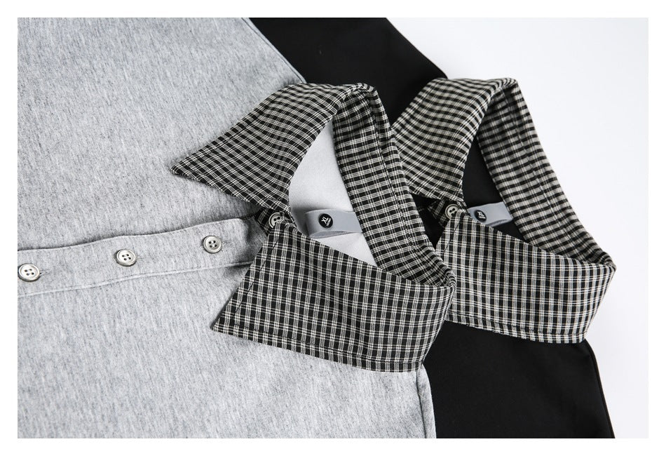Close-up of gray and black tops with black-and-white checked collars and button plackets.