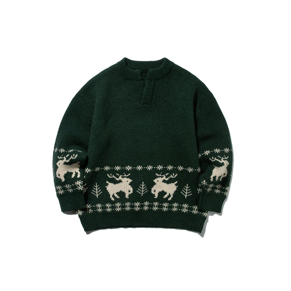 Green knit sweater with cream reindeer and snowflake jacquard band, ribbed notched neckline, front view