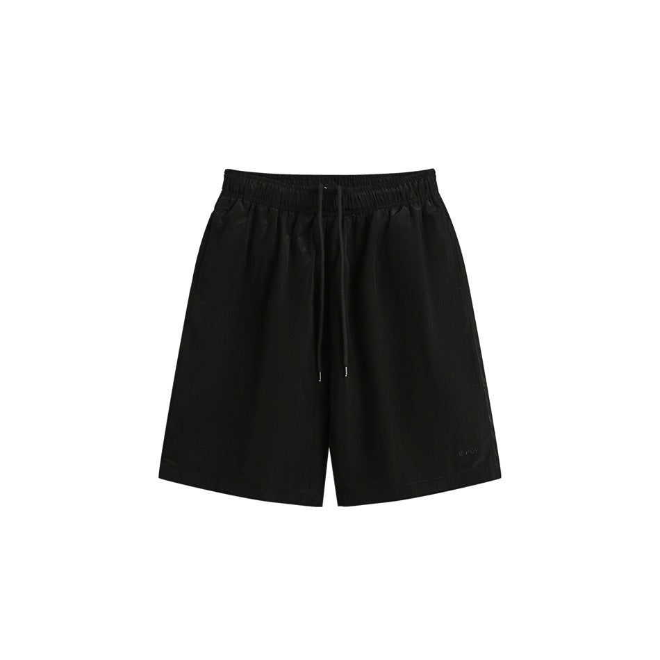 Black knee-length drawstring shorts with elastic waistband, flat front view on white background