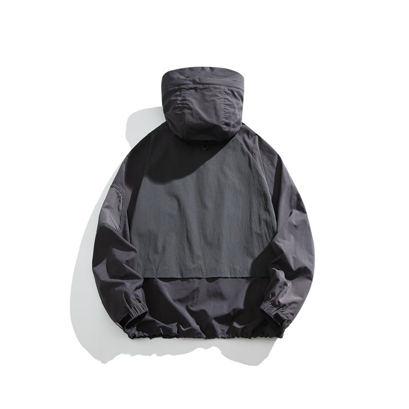Dark charcoal hooded pullover jacket shown from the back, with elastic cuffs and hem.