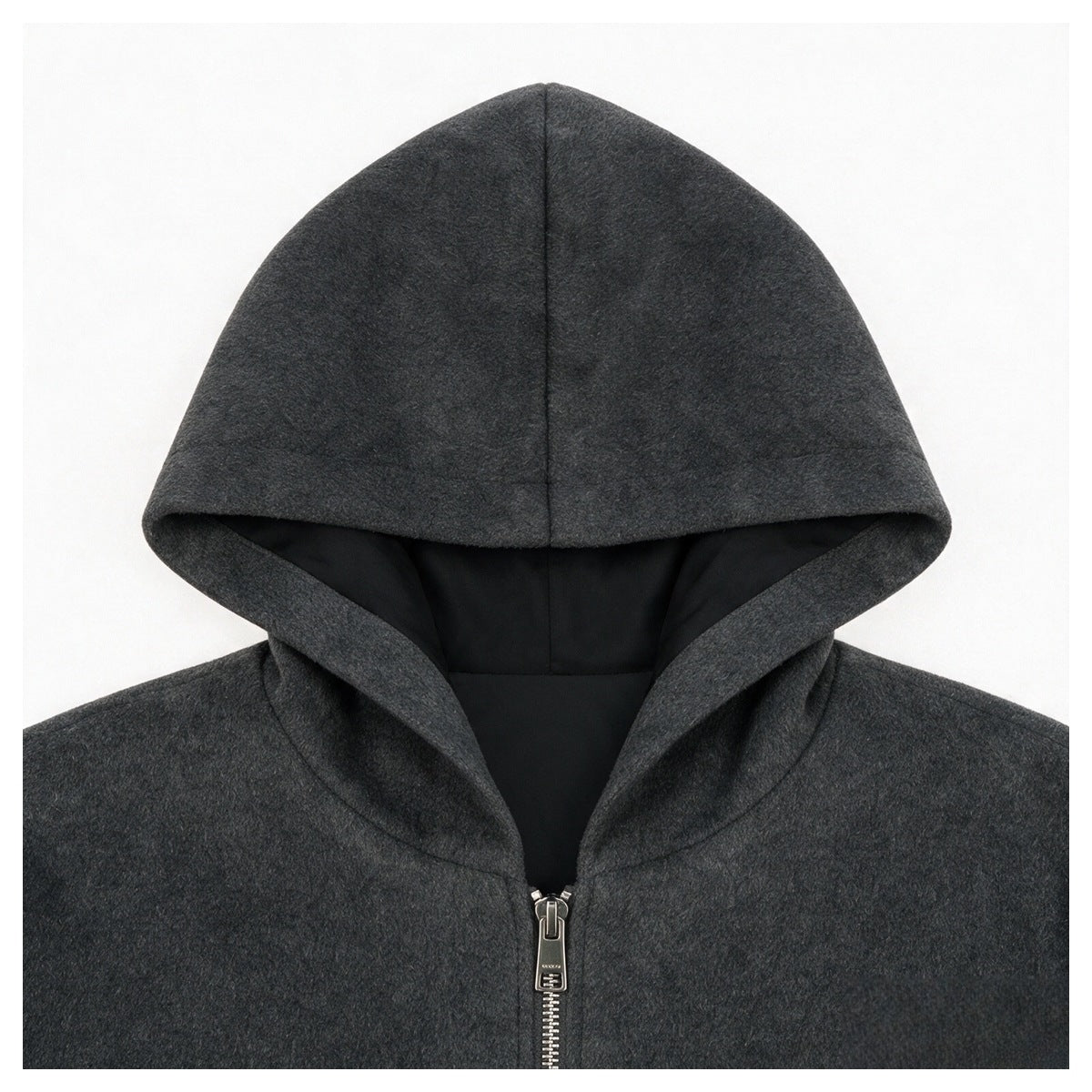 Close-up of the charcoal gray jacket's hood, black lining, and upper front zipper.