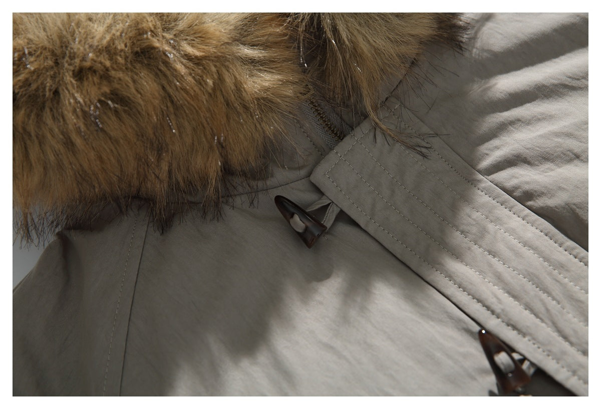 Close-up of the taupe jacket collar, fur trim, and dark toggle fastener.