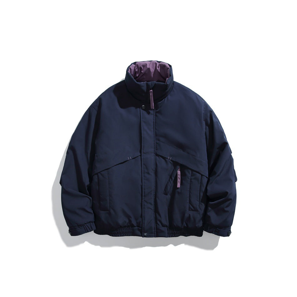 Navy padded stand-collar jacket flat lay with purple collar lining and purple pull tabs