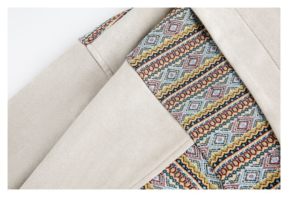 Close-up of a colorful geometric patterned panel between sections of light beige jacket fabric.