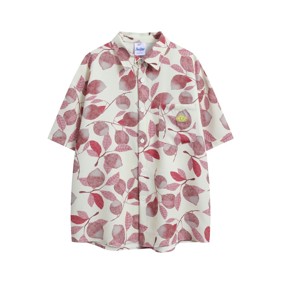 Cream short-sleeve button-up shirt with a pink and red lemon and leaf print and a chest pocket with a small logo patch