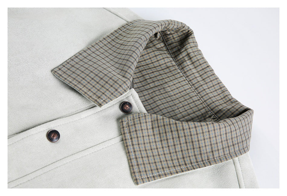 Close-up of the ivory jacket's plaid collar lining, dark buttons, and textured outer surface.