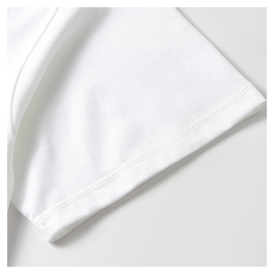 Close-up of a white shirt sleeve hem with parallel rows of stitching.