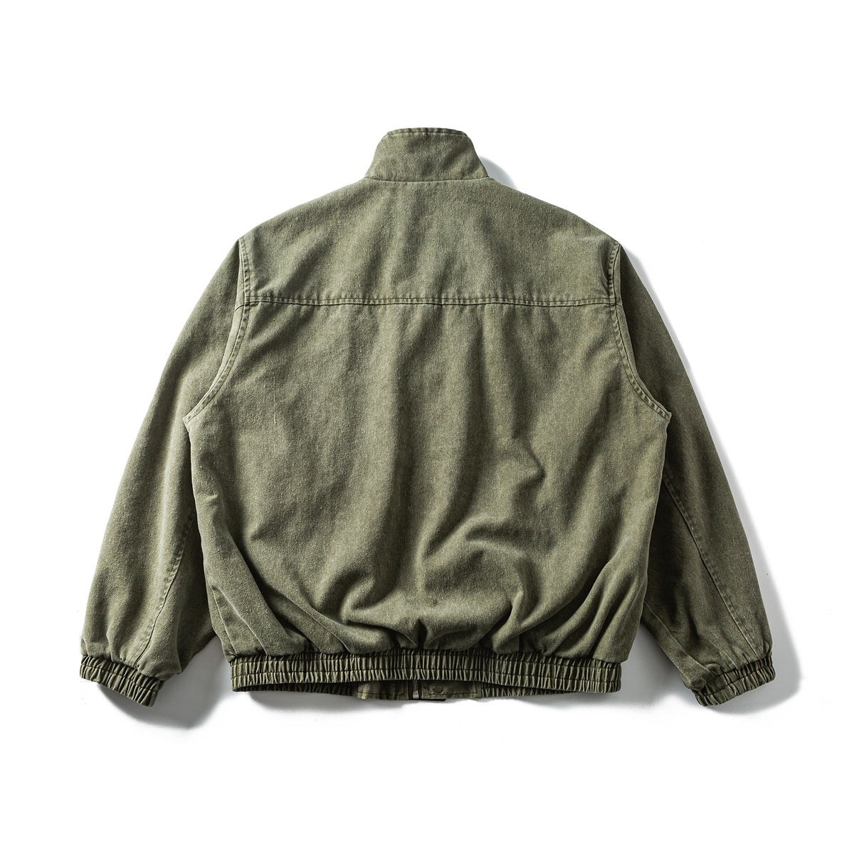 Back view of an olive-gray jacket with a stand collar and elastic cuffs and hem, laid flat on white.