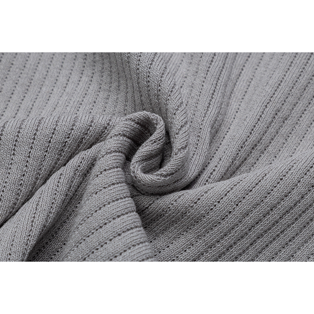 Close-up showing the gray T-shirt's ribbed knit texture and folded fabric.