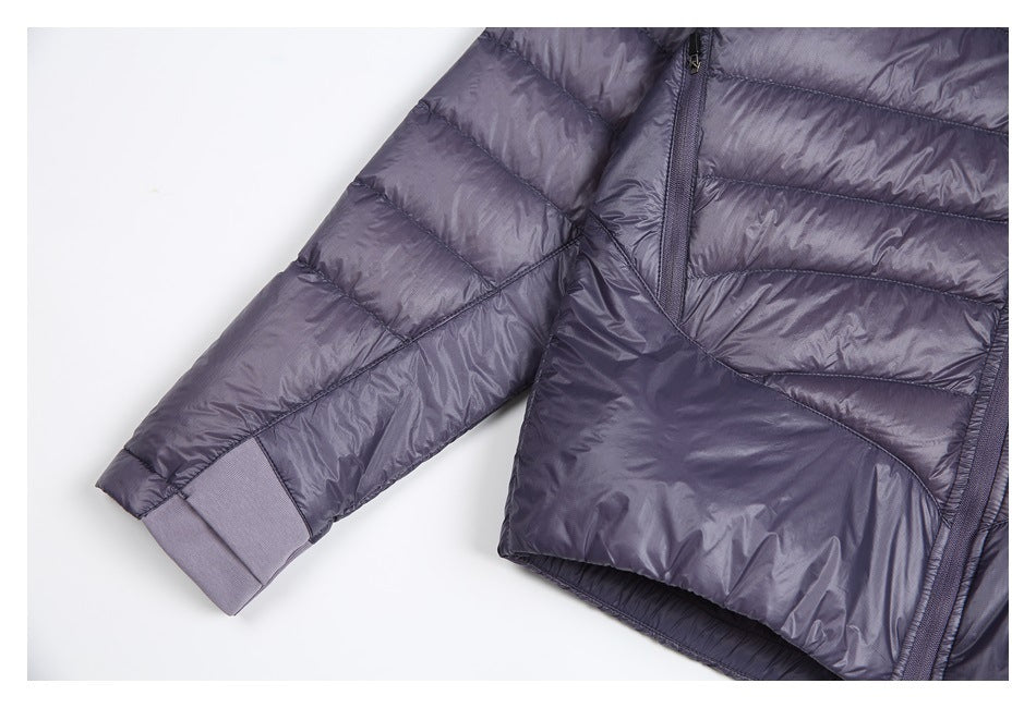 Close view of the jacket's quilted sleeve, ribbed cuff, lower front, and hem.