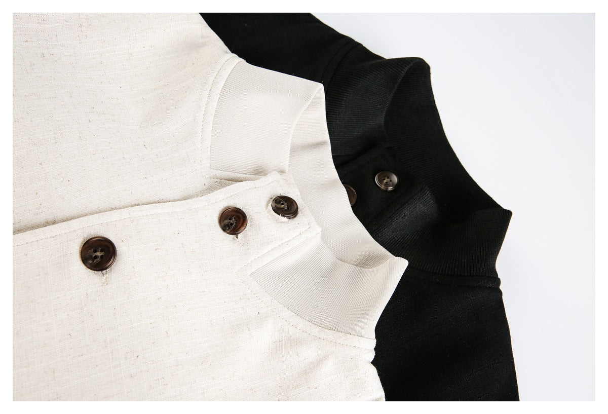 Close-up of cream and black jacket collars and buttoned front plackets.