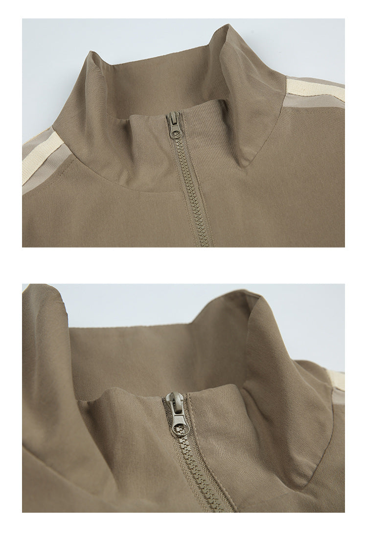 Two close-ups of the taupe jacket’s stand collar and front zipper.