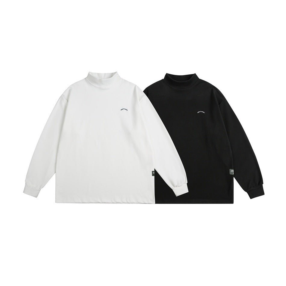 White and black long-sleeve mock-neck shirts shown from the front, each with a small chest mark.