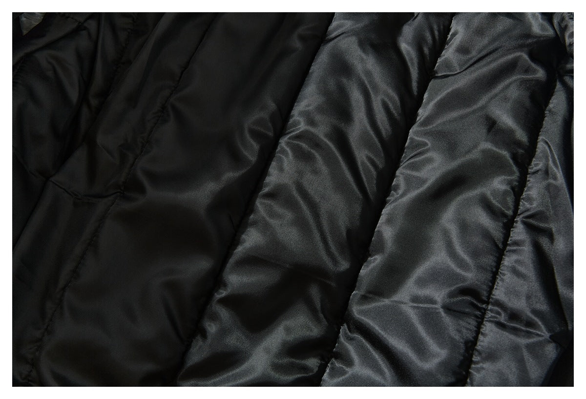 Close-up of the black quilted lining inside a jacket.