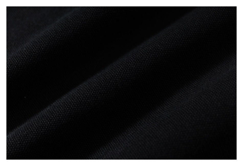 Macro view of the textured weave of black fabric.