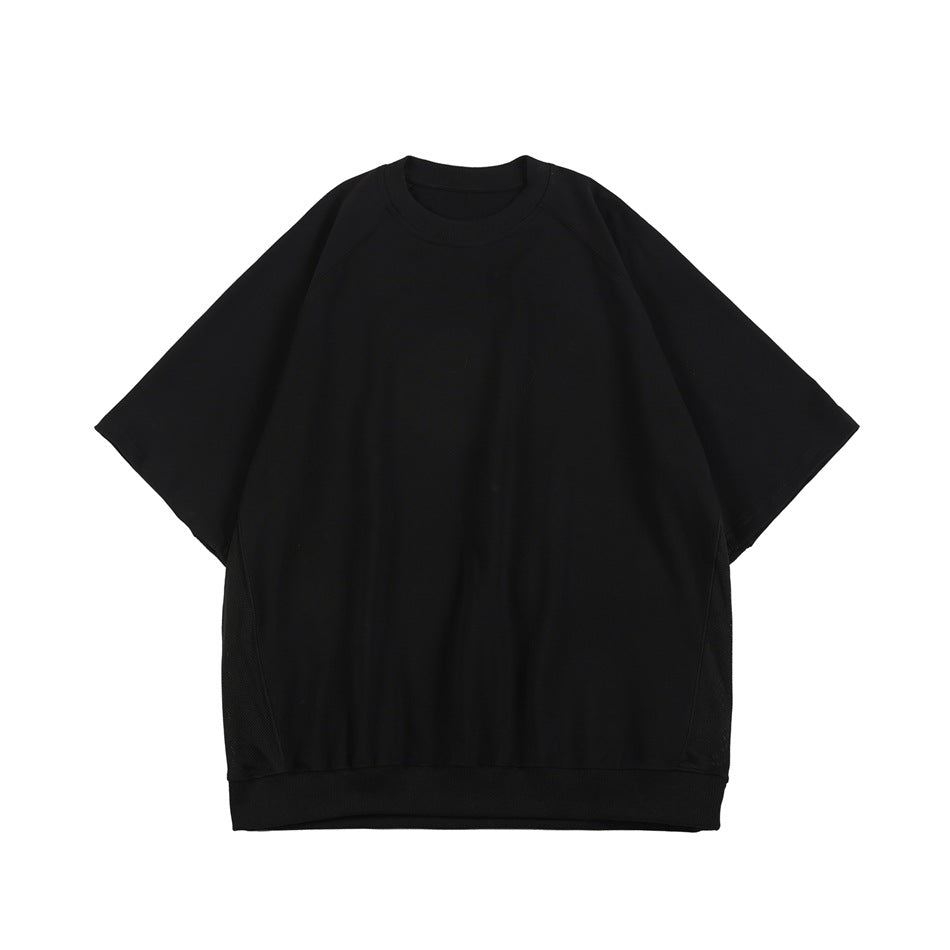 Front view of a plain black oversized short-sleeve crewneck top with a ribbed hem.