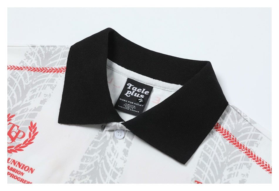 Close-up of a white patterned shirt with a black collar, white button, and black neck label.
