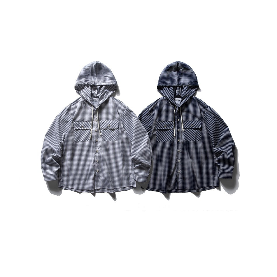 Two hooded button-front shirts with chest pockets in light and dark plaid, displayed flat against white.