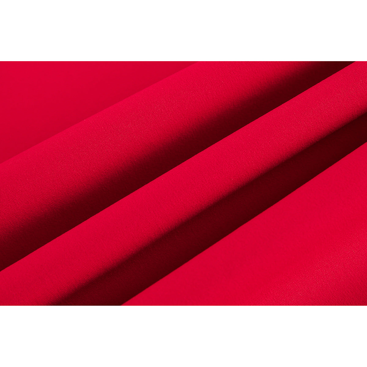 Extreme close-up of bright red shirt fabric folded to show its surface and texture.