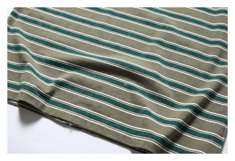 Close-up of olive-gray fabric with dark green and thin white horizontal stripes.