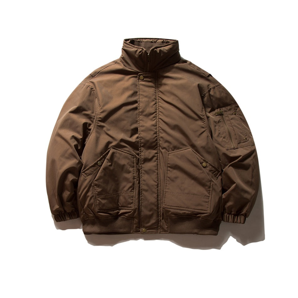 Coffee brown stand-collar jacket flat lay with zip front, flap snap pockets, sleeve zip pocket and ribbed hem