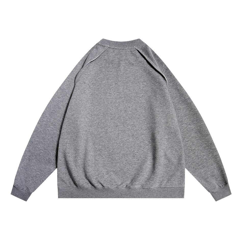 Back view of a dark heather gray crew-neck sweatshirt with raglan seams and ribbed cuffs and hem
