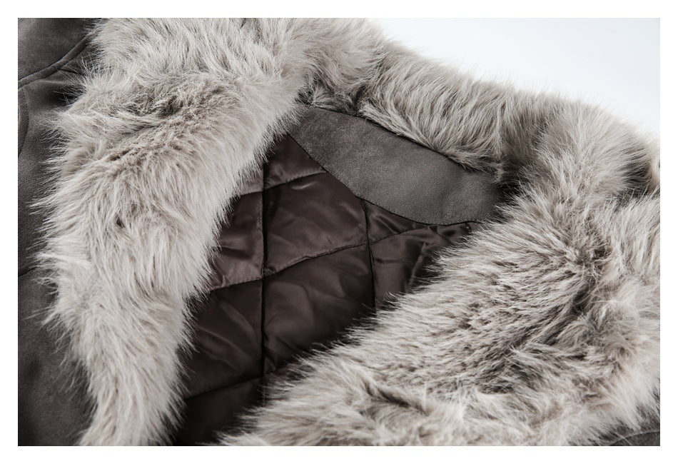 Close-up of a gray coat's pale faux-fur trim and dark quilted lining.